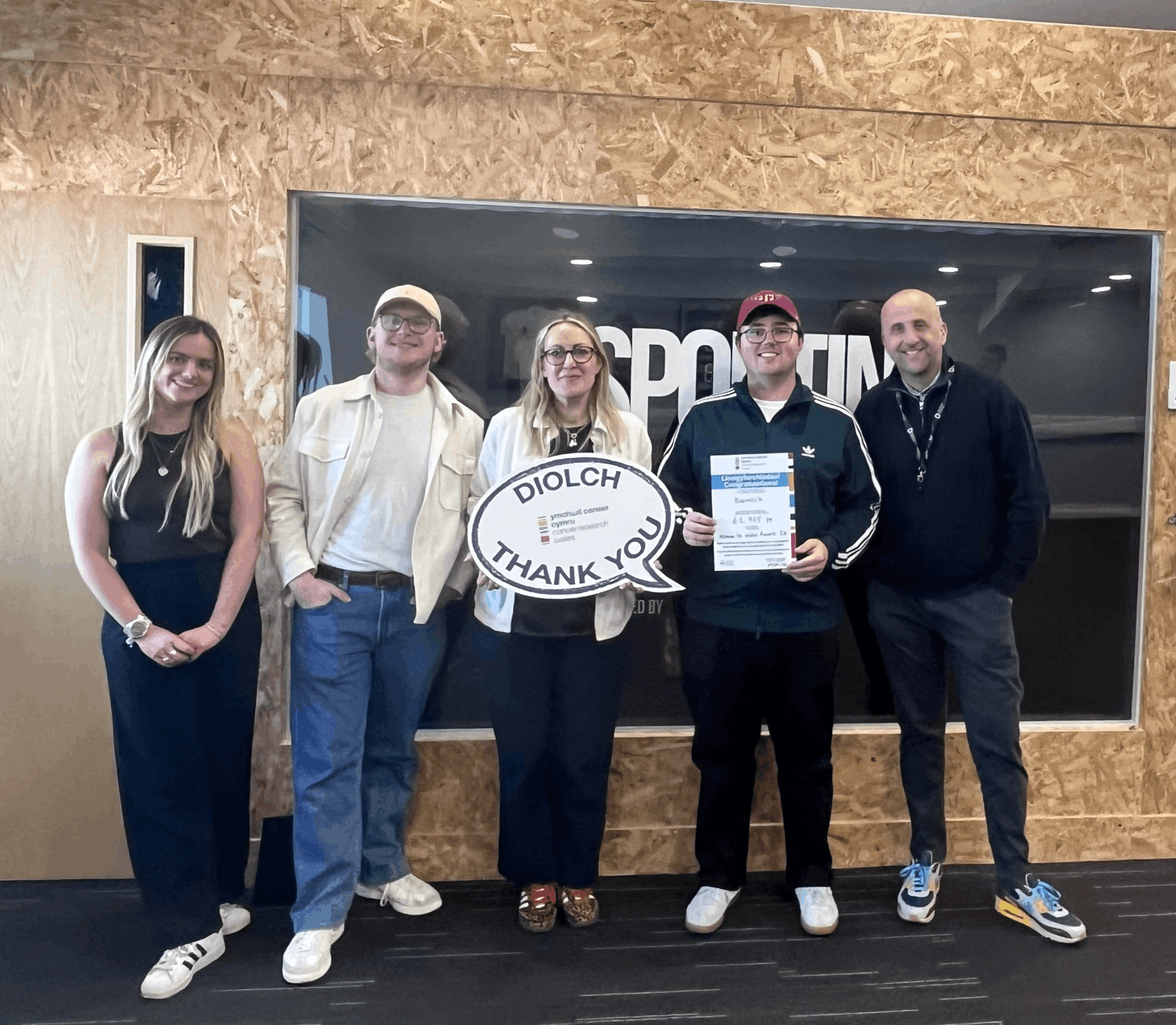 BusinessIn team presenting a Diolch / Thank You cheque from the WomenIn Wales Awards 2026